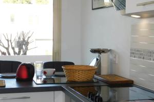 a kitchen with a counter with a sink and a window at Spacious T2 "Jardin du Pont du Lys" with pool and parking in Antibes