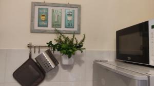 Televízia a/alebo spoločenská miestnosť v ubytovaní Playa Vacation House