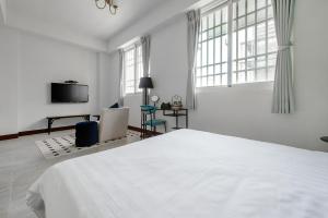 Een bed of bedden in een kamer bij Knock Knock Style Inn
