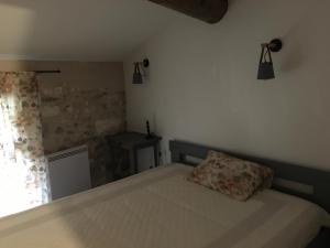 Posteľ alebo postele v izbe v ubytovaní Petite maison sur jardin secret