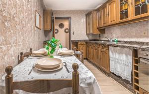 A kitchen or kitchenette at Stunning Apartment In Gijón With Wifi