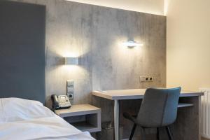Postel nebo postele na pokoji v ubytování Das Reinisch Just Rooms