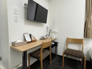 TV a/nebo společenská místnost v ubytování Ueno Urban Hotel Annex