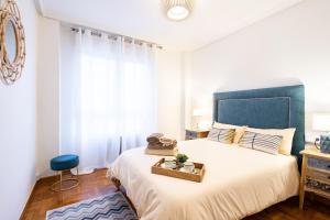 Postel nebo postele na pokoji v ubytování Primera línea de playa con plaza de garaje y WIFI