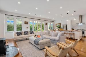 a living room with a couch and a table at Botham's Beauty - Blenheim Holiday Home in Blenheim