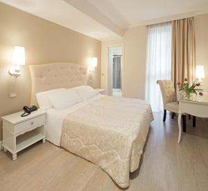 Postel nebo postele na pokoji v ubytování Hotel Aurora