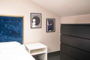 A bed or beds in a room at Le Stanze di Gianmarmo - Via di Mezzo