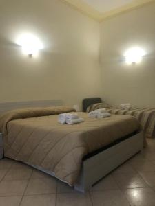 A bed or beds in a room at Guest House Via Poerio