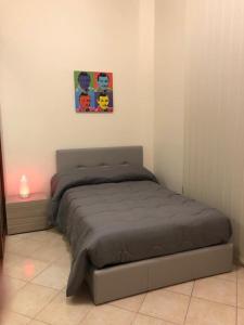 A bed or beds in a room at Guest House Via Poerio