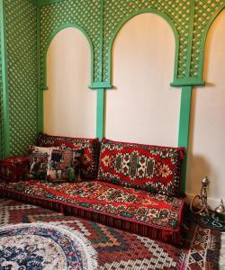 a couch sitting in a room with a wall at Villa Kayi Kottage in Peaceful calis few minutes from Çaliş sunny Beach in Fethiye +35 photos