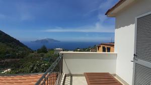 a balcony with a view of the ocean at SANTACROCE&S.ANTONINO HOUSE in Termini