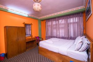 Postel nebo postele na pokoji v ubytování Hotel Pomelo House Inn