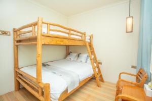 Postel nebo postele na pokoji v ubytování Nanjing Tulou Xinyuan HomeStay