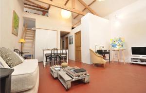 a living room with a couch and a table at Beautiful Apartment In La Gaude With Kitchenette in La Gaude