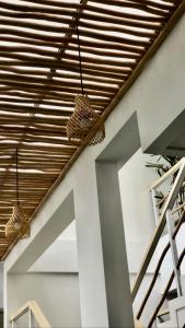 a room with two baskets hanging from the ceiling at Best Canggu Hostel in Canggu