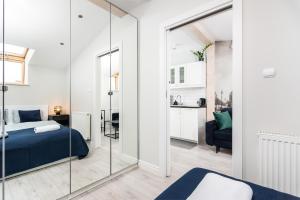 Łóżko lub łóżka w pokoju w obiekcie Ariańska apartment - Cracow, city centre