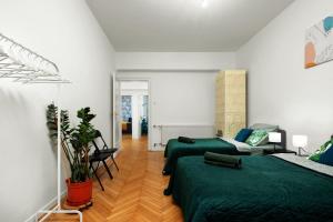 Łóżko lub łóżka w pokoju w obiekcie Apartament blisko Wawelu