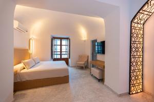 Posteľ alebo postele v izbe v ubytovaní Hotel Casa Palacio la Sal