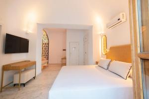 Posteľ alebo postele v izbe v ubytovaní Hotel Casa Palacio la Sal