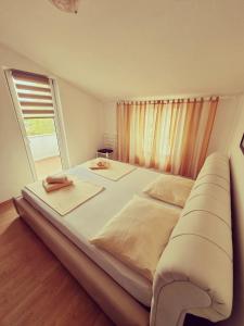 Postel nebo postele na pokoji v ubytování Apartments Nada + 15 fotografií