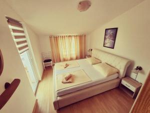 Postel nebo postele na pokoji v ubytování Apartments Nada