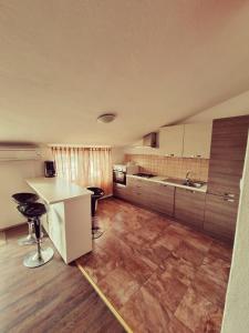 Kuchyň nebo kuchyňský kout v ubytování Apartments Nada