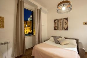 a bedroom with a bed and a window at Fornaci Vatican Flat in Rome