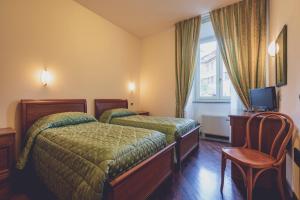 מיטה או מיטות בחדר ב-Albergo Ristorante Pasqui