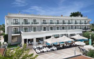 an image of a hotel with tables and umbrellas at Danai Hotel & Spa in Olympic Beach