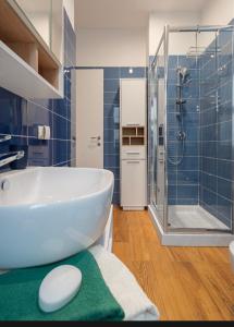 a bathroom with a white sink and a shower at Casa Gioggiò in Terni