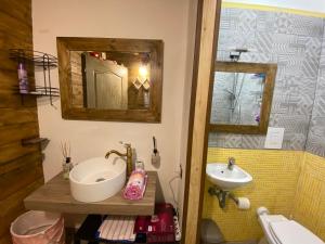 a bathroom with a sink and a mirror at Sarno Domus Grazioso Loft 2 livelli Centro Storico in Sarno