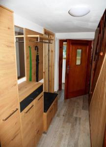 an interior of a tiny house with a door at Ferienhaus In der Erlebach in Elmstein