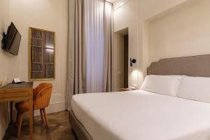 Postel nebo postele na pokoji v ubytování Hotel Smeraldo