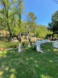 a row of tables in a field with trees at Dalya Life in Göcek