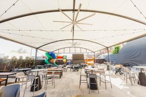 a cafeteria with tables and chairs under a tent at The Albion Hotel in Cootamundra