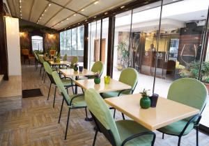 a row of tables and chairs in a restaurant at Mira Otel Alsancak in İzmir