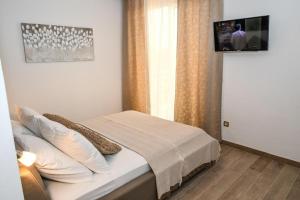 Posteľ alebo postele v izbe v ubytovaní Villa Isabella