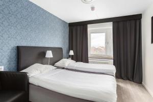 Postel nebo postele na pokoji v ubytování Best Western Hotel Tranas Statt