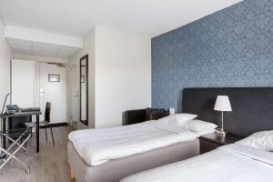 Postel nebo postele na pokoji v ubytování Best Western Hotel Tranas Statt