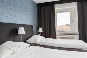 Postel nebo postele na pokoji v ubytování Best Western Hotel Tranas Statt