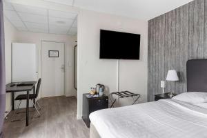 Postel nebo postele na pokoji v ubytování Best Western Hotel Tranas Statt