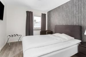 Postel nebo postele na pokoji v ubytování Best Western Hotel Tranas Statt