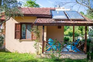 a house with a solar panel on the roof at Dalya Life in Göcek