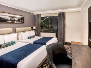 Voodi või voodid majutusasutuse Mövenpick Hotel Ikoyi Lagos toas