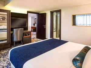 Voodi või voodid majutusasutuse Mövenpick Hotel Ikoyi Lagos toas
