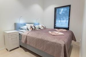 Postel nebo postele na pokoji v ubytování Luxury Suite Vaarala
