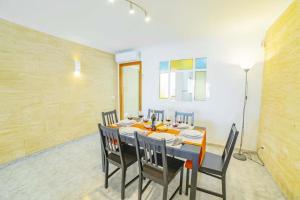 a dining room with a table and some chairs at Coastal House Sa Fortalesa in Alcudia in Alcudia +19 photos