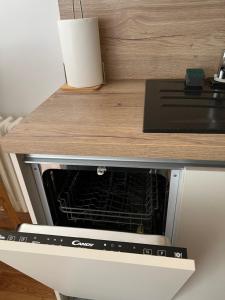 a microwave oven sitting on top of a counter at Apartment Ura in Rijeka