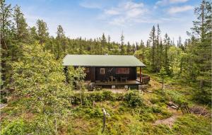 a small cabin in the middle of a forest at Amazing Home In Eggedal With 3 Bedrooms in Eggedal