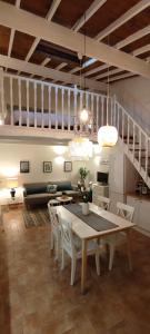 a kitchen and dining room with a table and chairs at Chill Out Cabanon Coeur Calanques in Marseille